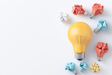 Bright yellow light bulb surrounded by colorful crumpled paper shapes in various colors, symbolizing creativity and innovative ideas. arrangement creates visually appealing contrast