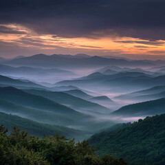 Obraz premium Fog drifting between green mountain layers during early morning sunrise