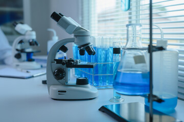 Scientific Laboratory with Microscope and Blue Liquid Samples