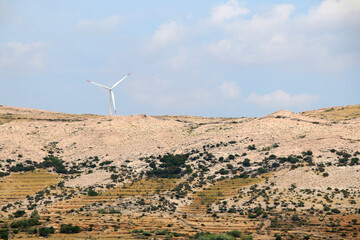 Wind turbine on the hill on island Pag, Croatia.
