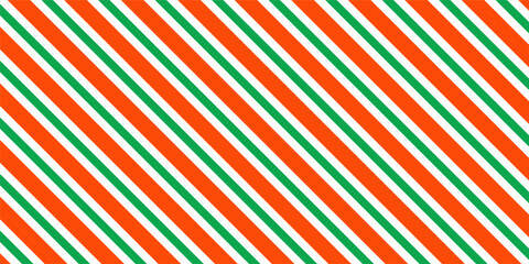 Christmas seamless pattern. Red and green diagonal stripes background. Candy cane repeating decoration wallpaper. Winter holiday lines backdrop. Xmas peppermint present wrapping print design. Vector