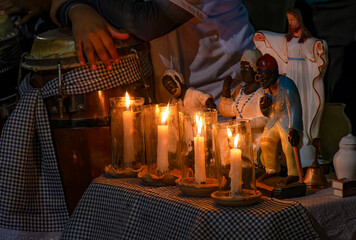 Altar with saints and Umbanda entities in the streets of Belo Horizonte, Minas Gerais, lit with...