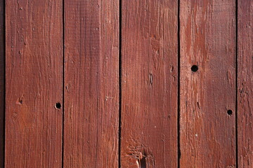 Naklejka premium Rustic Dark Red Wooden Planks with Visible Grain and Nails
