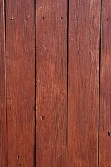 Naklejka premium Rustic Dark Red Wooden Planks with Visible Grain and Nails