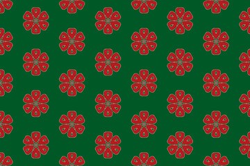 Seamless red floral pattern on green surface