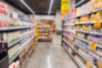 Blurred supermarket aisle with products on shelves. Empty and blurred supermarket aisle
