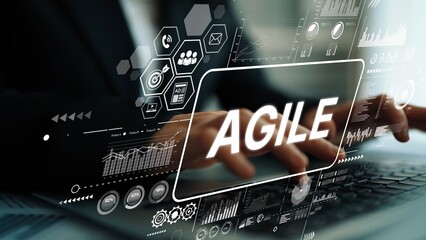 Business Professional Typing on Laptop with Agile Concept Illustrating Digital Transformation in...
