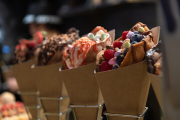 Evening dessert shop with creative cones and various toppings