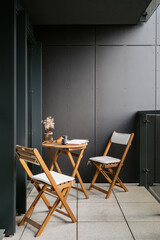 Modern balcony in loft style apartment with cozy seating for relaxation