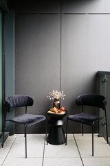 Modern loft-style balcony with sleek furniture ideal for relaxation and leisure