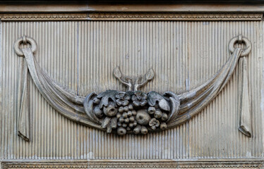 Stone wall with carved floral pattern	