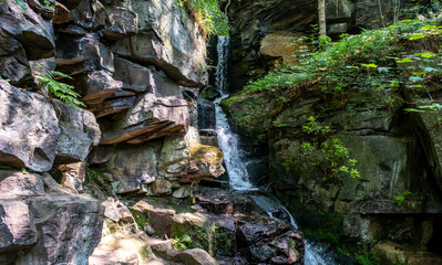 Fototapeta premium The remains of the Lumsdale Valley waterfall, a water fall that was once used to power several mills in the Lumsdale Valley