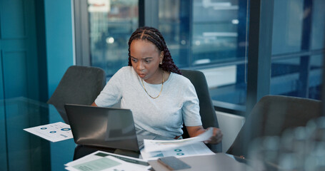 Office, laptop and black woman with paperwork, typing and accountant for financial report and...