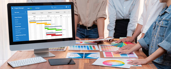 Project planning software for brisk business project management on the computer screen showing...
