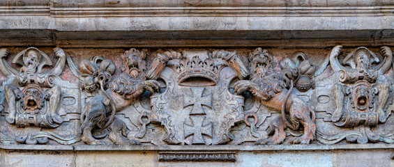 Medieval stone panel with lions and royal coat of arms	