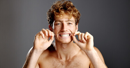 Dental hygiene, flossing and portrait of man in studio with fresh breath, health or plaque removal....