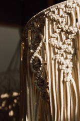 Handmade macrame art displayed in a cozy indoor space with natural light in the afternoon