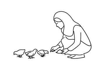 Woman feeding chicks poultry farm