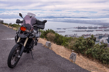 Black Adventure Motorcycle with Elevated View of Table Bay, Cape Town, South Africa