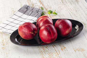 Ripe sweet juicy nectarines heap