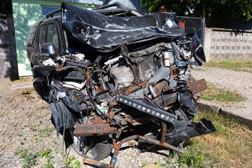 A completely destroyed car after an accident.