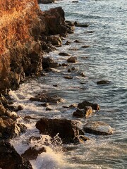 Landscape of sea shore with rocks outdoors. Summer vacation season. 