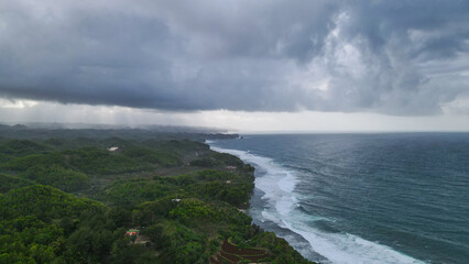 Dramatic Coastal Storm with Lush Hills.