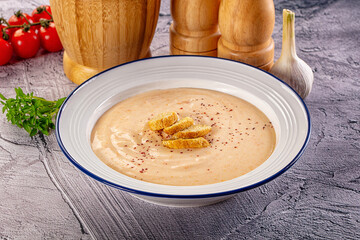 Tasty cheese cream soup with crouton