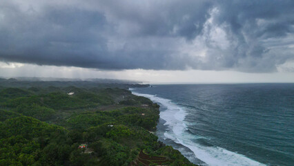 Dramatic Coastal Storm with Green Hills.