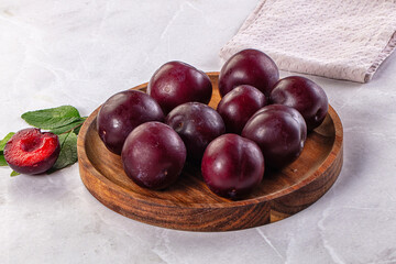Raw ripe purple plum heap