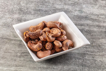 Unpeeled cashew nuts in the bowl