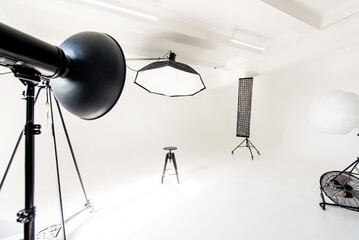 Modern cyclorama photo studio with lighting equipment and minimalist design for creative projects
