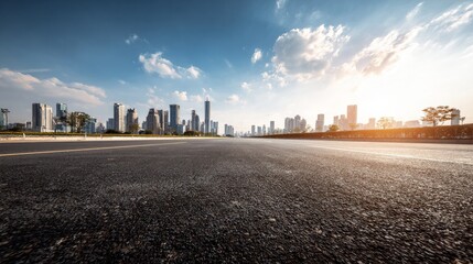 Obraz premium Open stretch of asphalt road leading to a scenic urban skyline on a sunny day