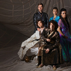 Group portrait in Arabic fairytale style, young men and women in ornate Ottoman costumes, fantasy...