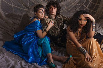 Ottoman Empire inspired group portrait, young models in historical costumes, fantasy aesthetic