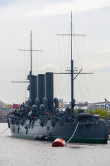 Historic cruiser warship museum moored on a city river © Mariia