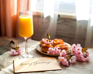 A still life featuring pink flowers and mimosas for a spring brunch.