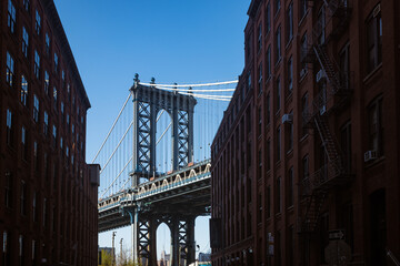 Manhattan Bridge through Brick Buildings 
