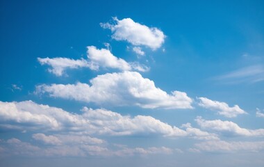 Fototapeta premium A clear blue sky with fluffy white clouds