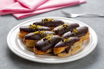 Traditional french eclairs with chocolate.