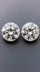 Two Brilliant Cut Diamonds on a Dark Background Displaying Sparkle