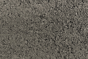 Grey rough asphalt surface road texture. Design for brutal background. Top view close-up.