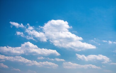 Obraz premium A clear blue sky with fluffy white clouds