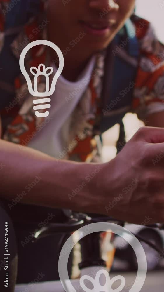 Poster animation of light bulb icons and data processing over african american man using smartphone