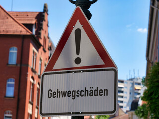 German sign with the word: Gehwegschäden, in English Pavement damage