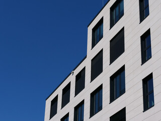 Front of a new high-rise building with blue sky