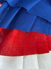 red, white, and blue burlap fabric background symbolic of Fourth of July and Independence Day