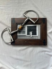 horse bit and rustic framed picture of horse