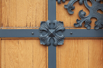 Decorative element on the wooden door of the house, close-up
