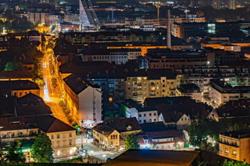 Ljubljana cityscape at night with skyline, streets and historic buildings